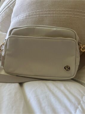 lululemon athletica Cream Crossbody Pouch with Gold Hardware